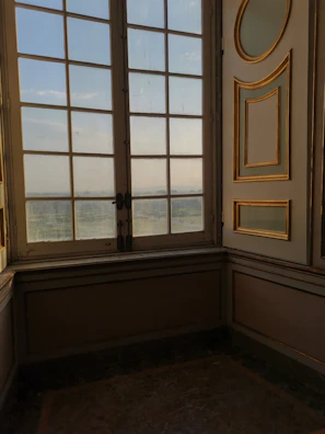 Interior shot showing elegant wood trim around windows glowing in natural light.