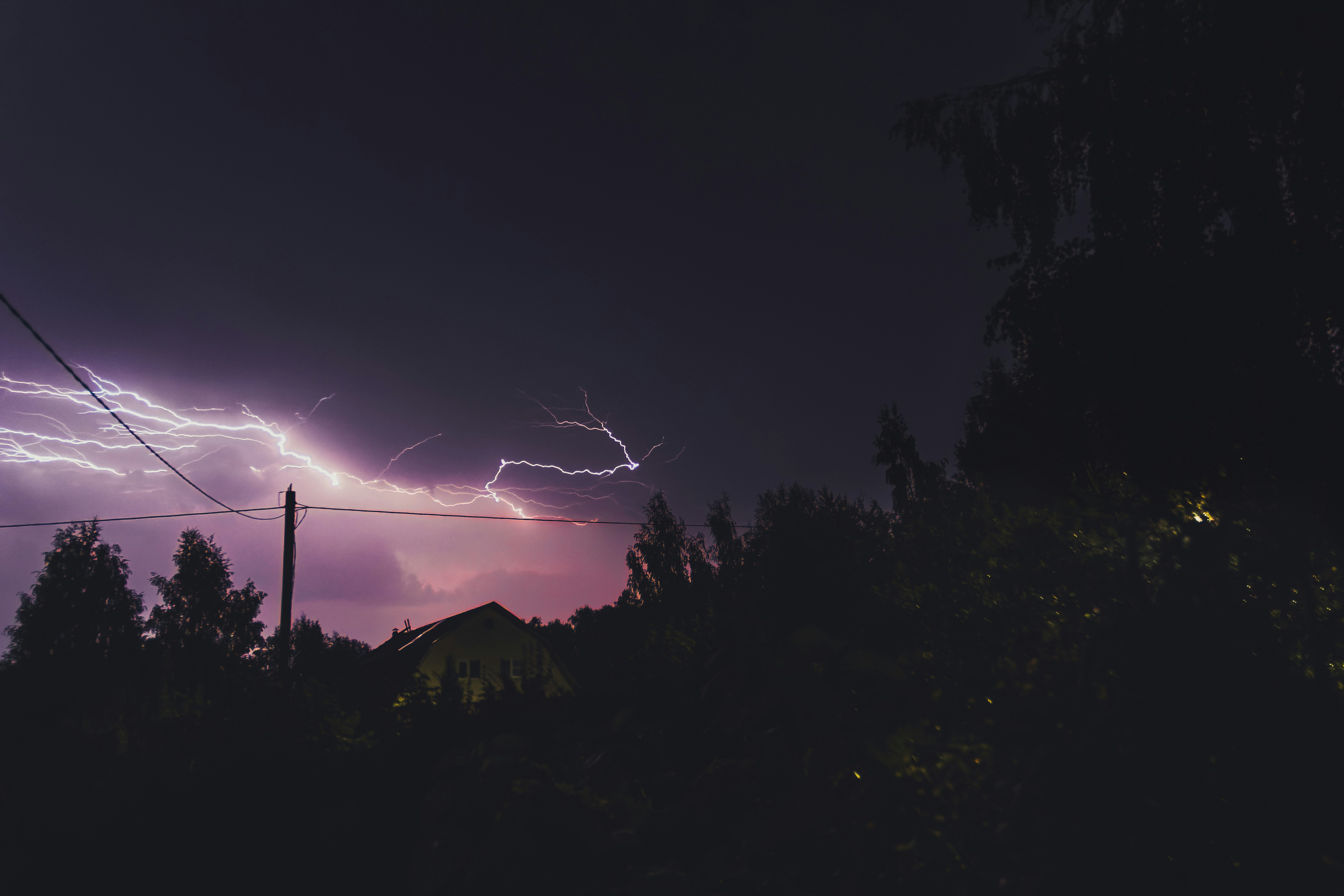 a lightning bolt is seen in the night sky