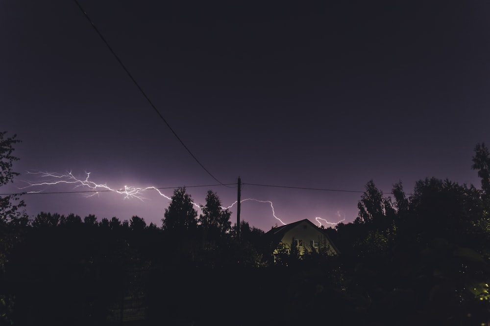 a dark sky with a lightning bolt in the distance