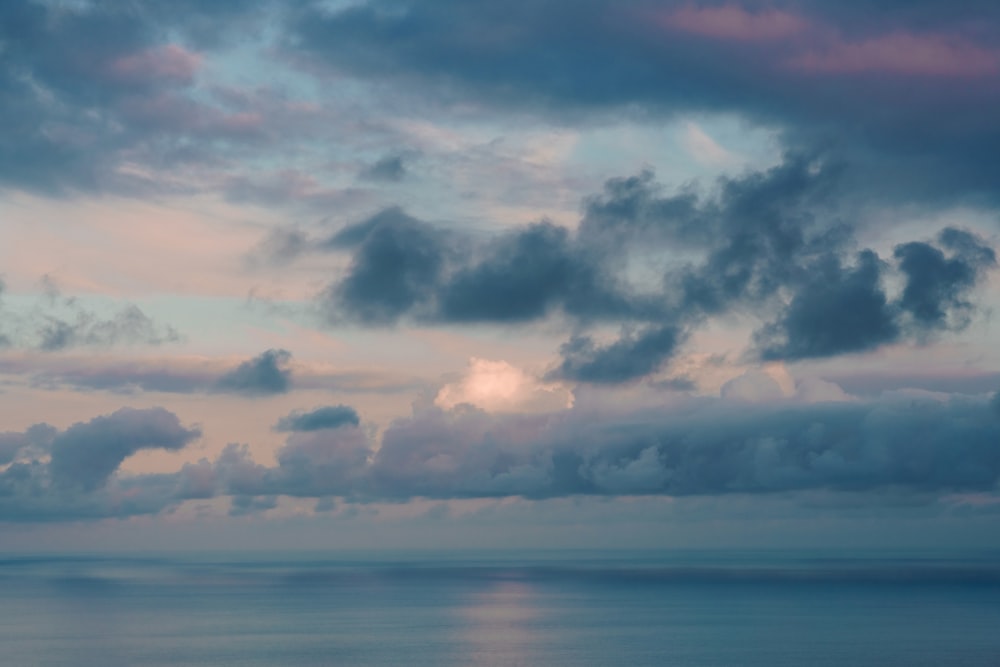 a large body of water under a cloudy sky