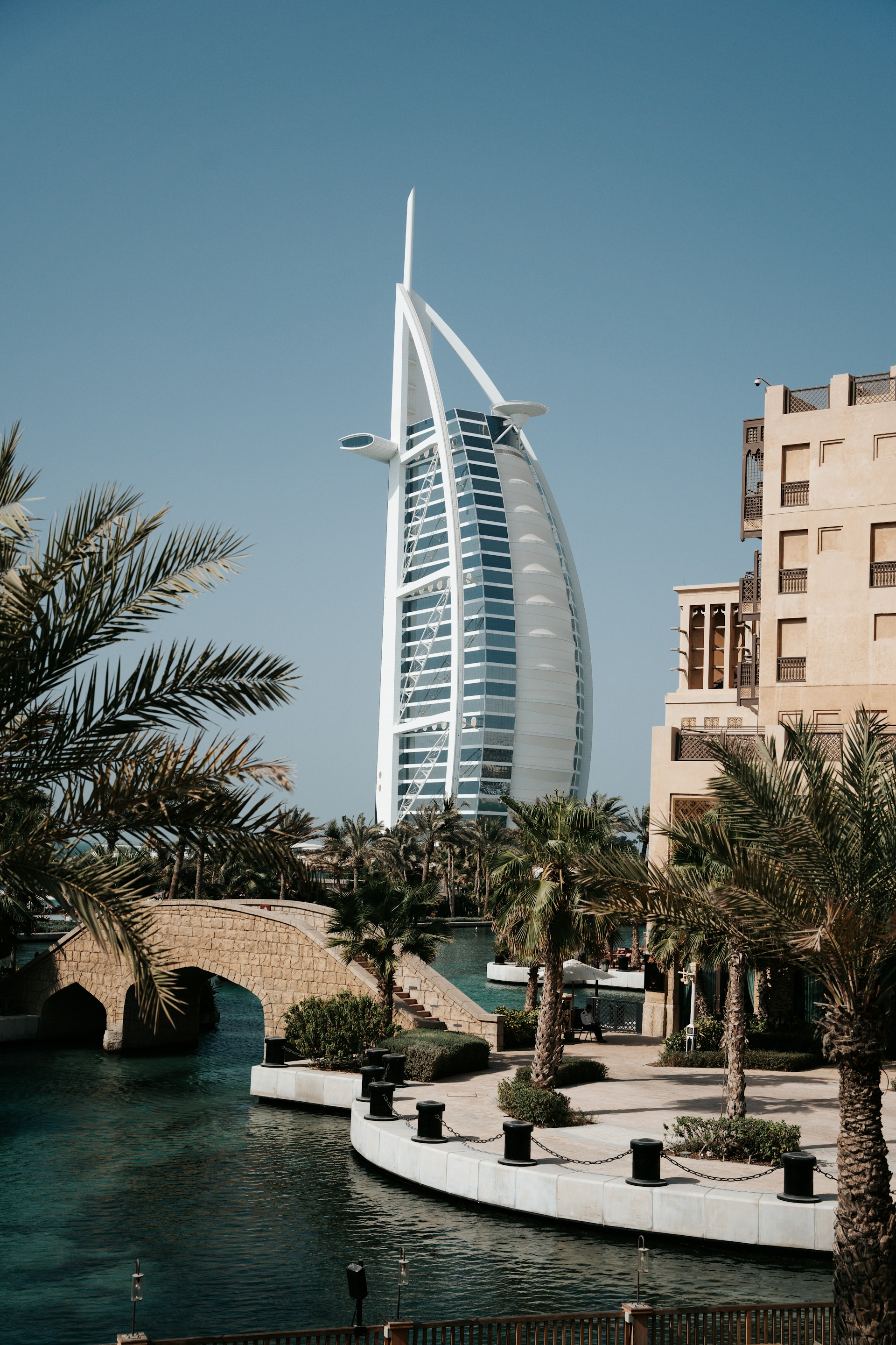 a tall building sitting next to a body of water