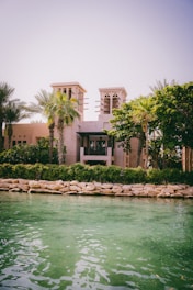 a large building sitting next to a body of water