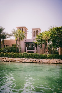 a large building sitting next to a body of water