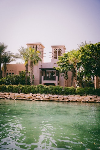 a large building sitting next to a body of water