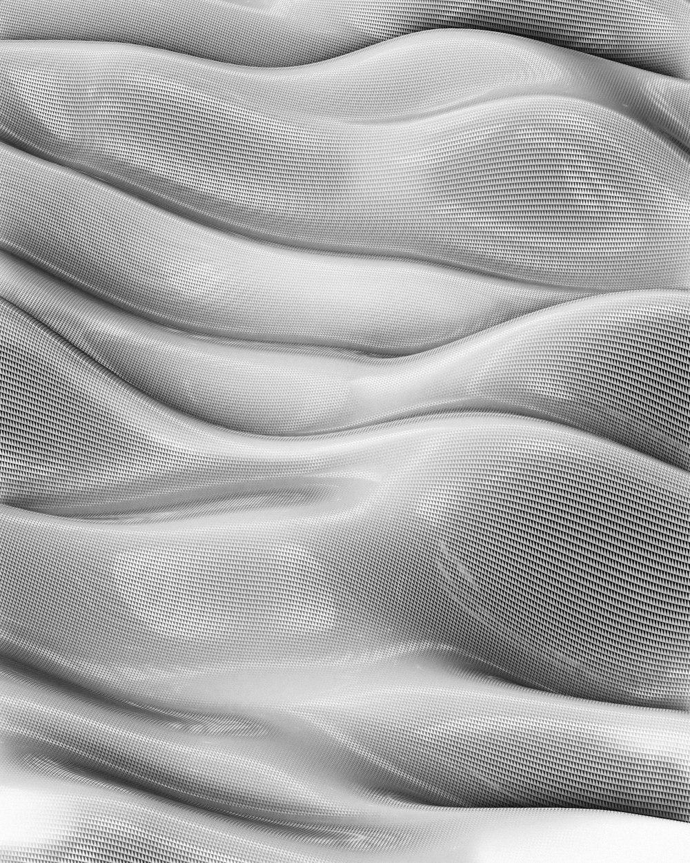 Una foto in bianco e nero di una superficie ondulata