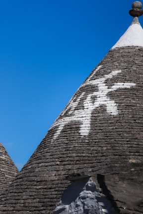 Close-up of traditional trulli houses with whitewashed walls and conical roofs