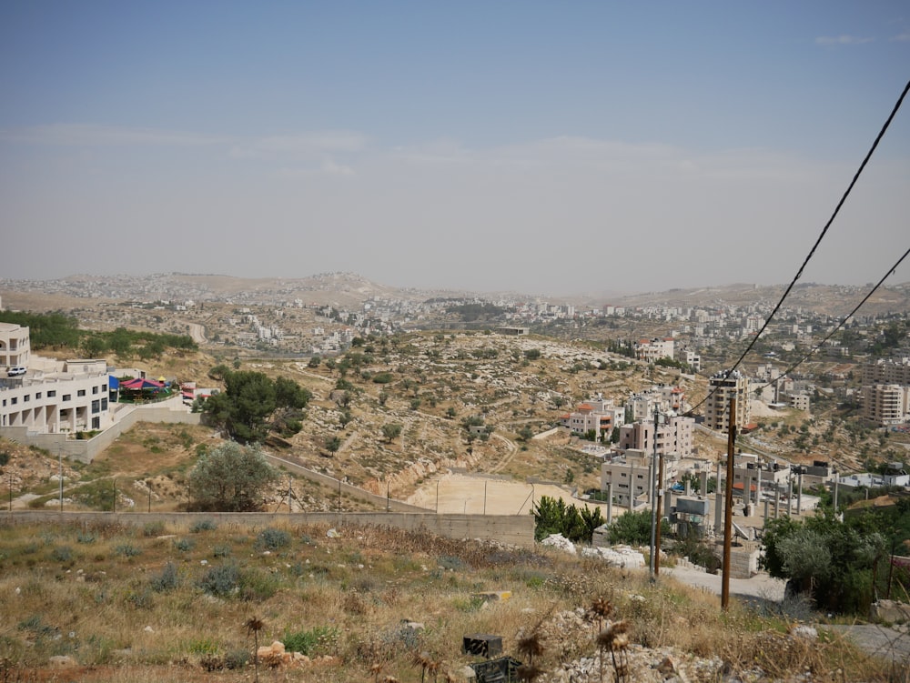 a view of a city from the top of a hill