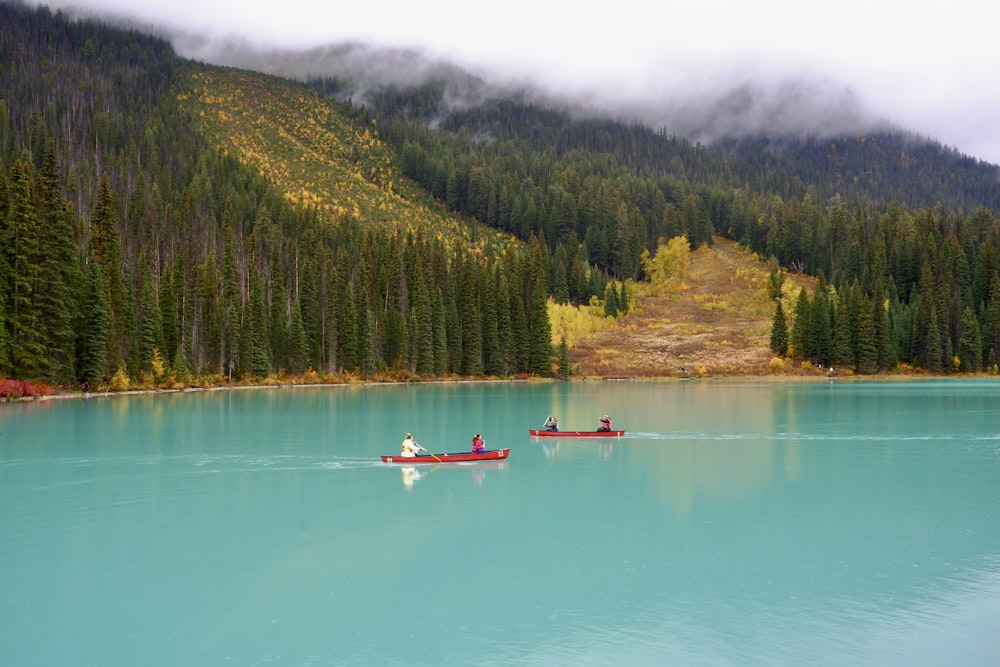 a couple of people in a boat on a lake