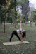 new book coming soon image with a woman doing a yoga pose in a park