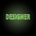 Neon green text with the word 'DESIGNER' on a dark background, glowing brightly with a soft green hue around the letters.