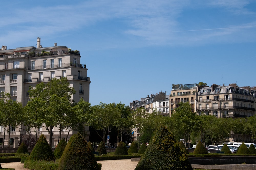 a large building with a lot of trees in front of it