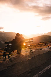 A cozy couple enjoying a sunset view over the serene mountains of Neelum Valley.