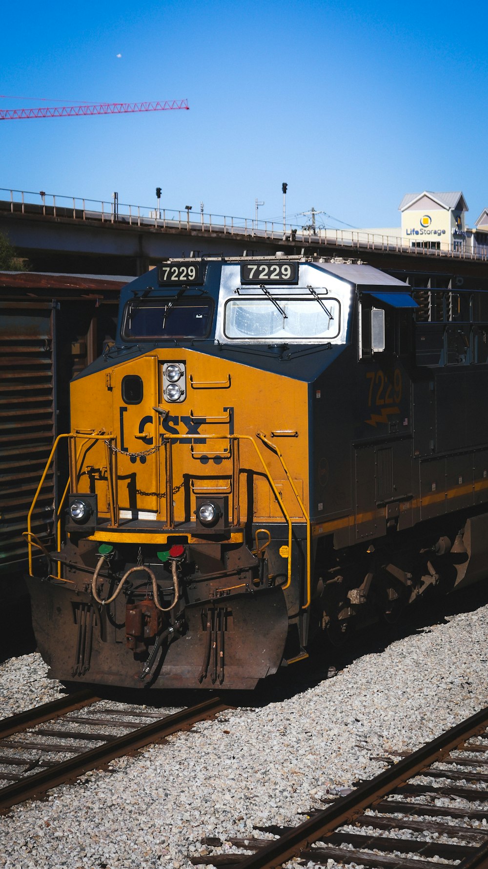 a black and yellow train traveling down train tracks