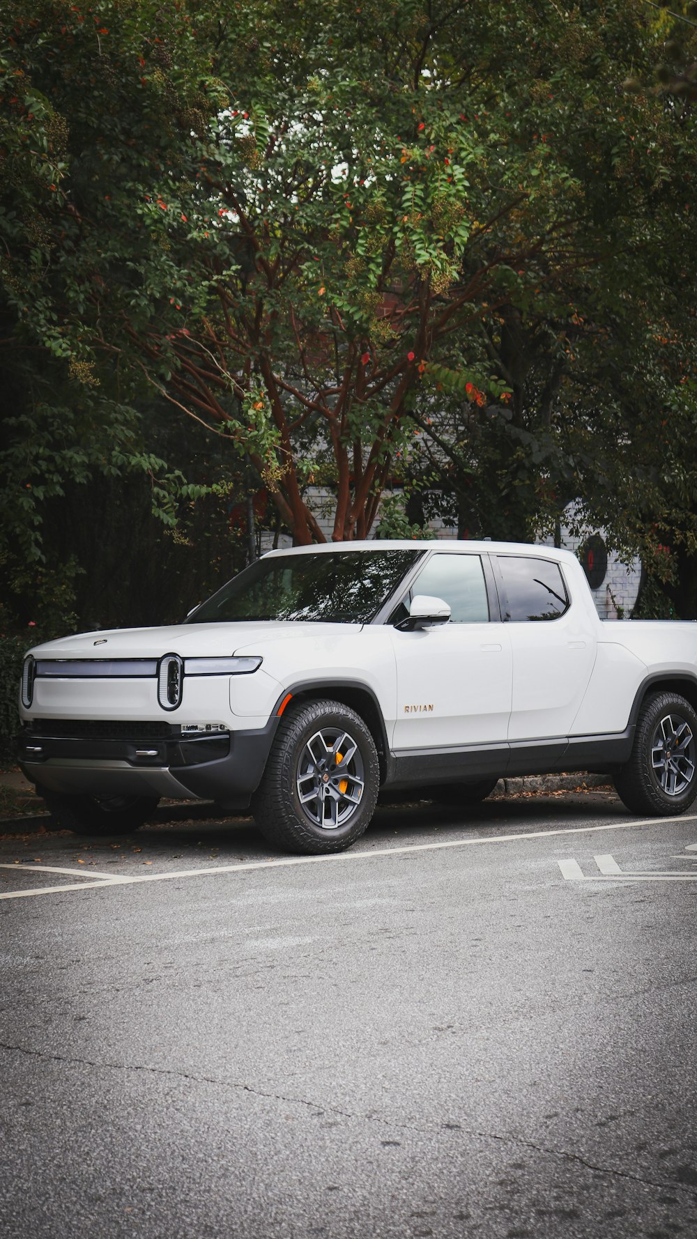 a white truck parked in a parking lot