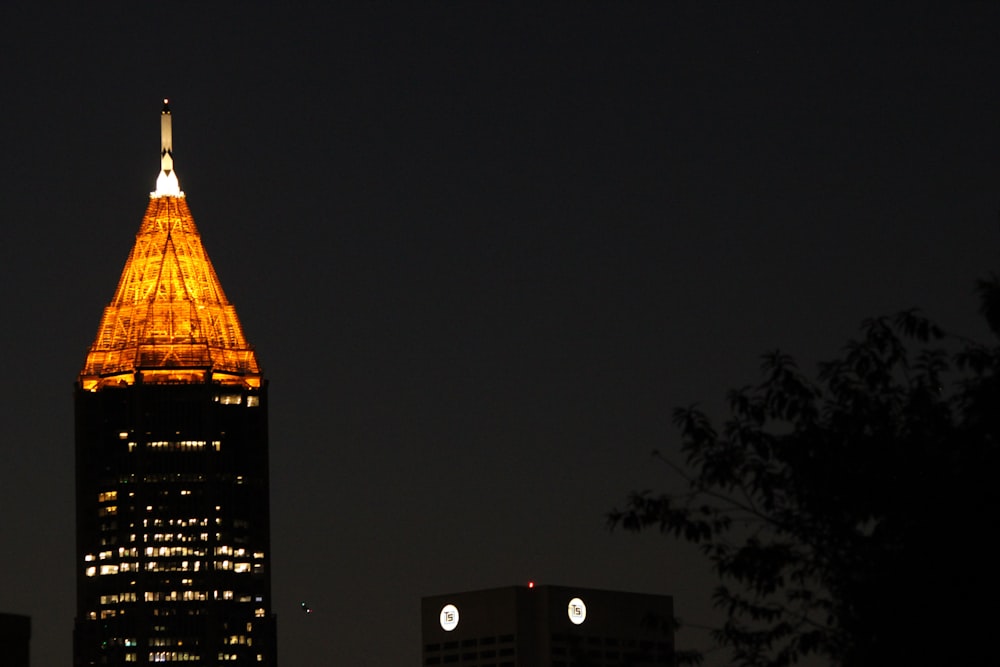 a very tall building lit up at night