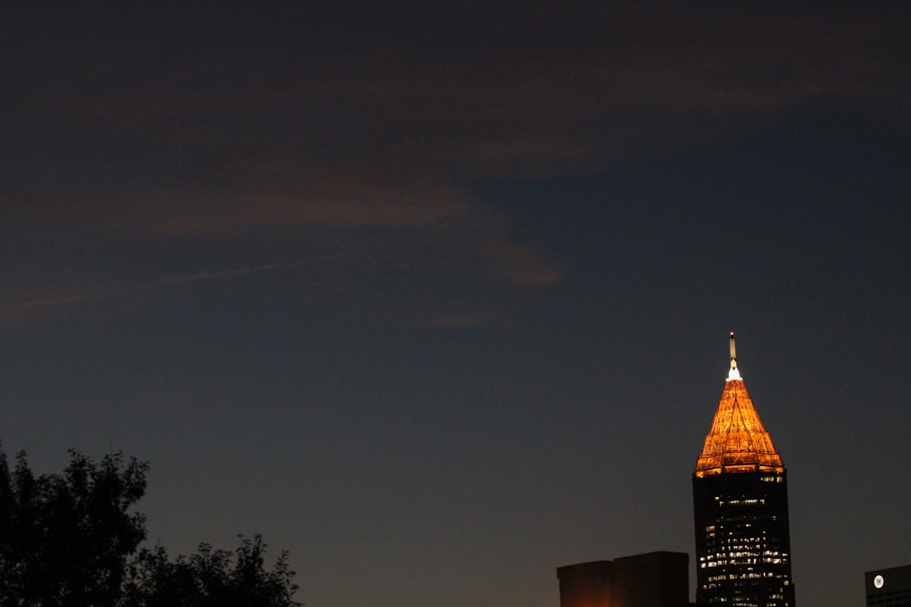 a very tall building lit up at night