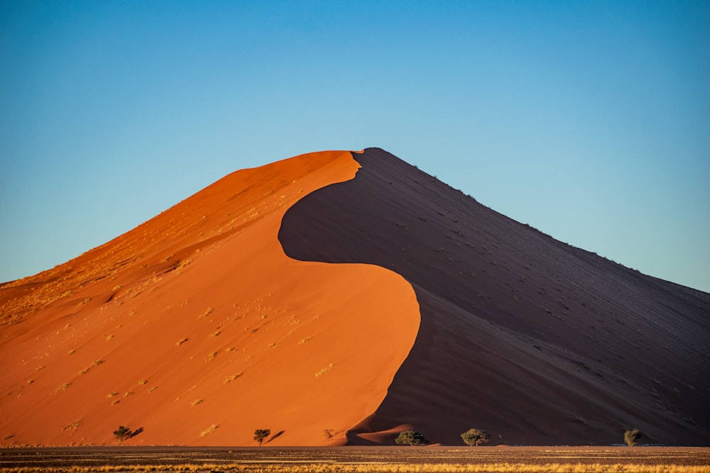 a large sand dune in the middle of a desert