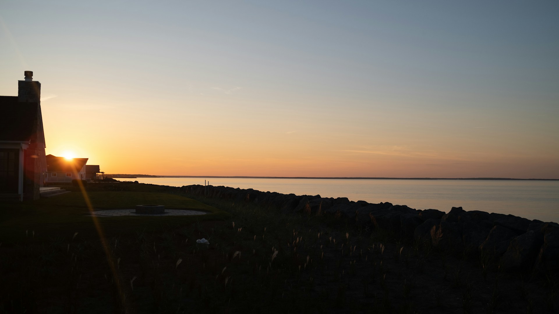 woman wearing yellow long-sleeved dress under white clouds and blue sky during daytime