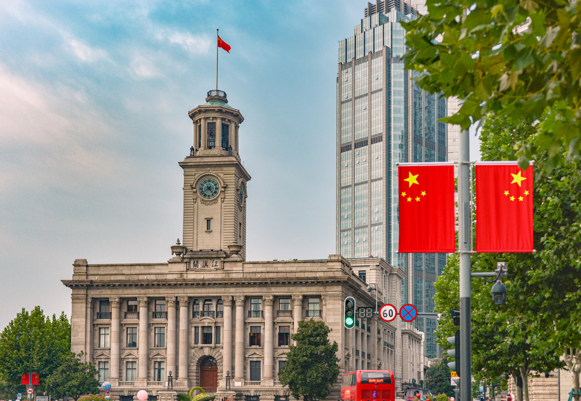 a large building with a clock tower in the middle of a city