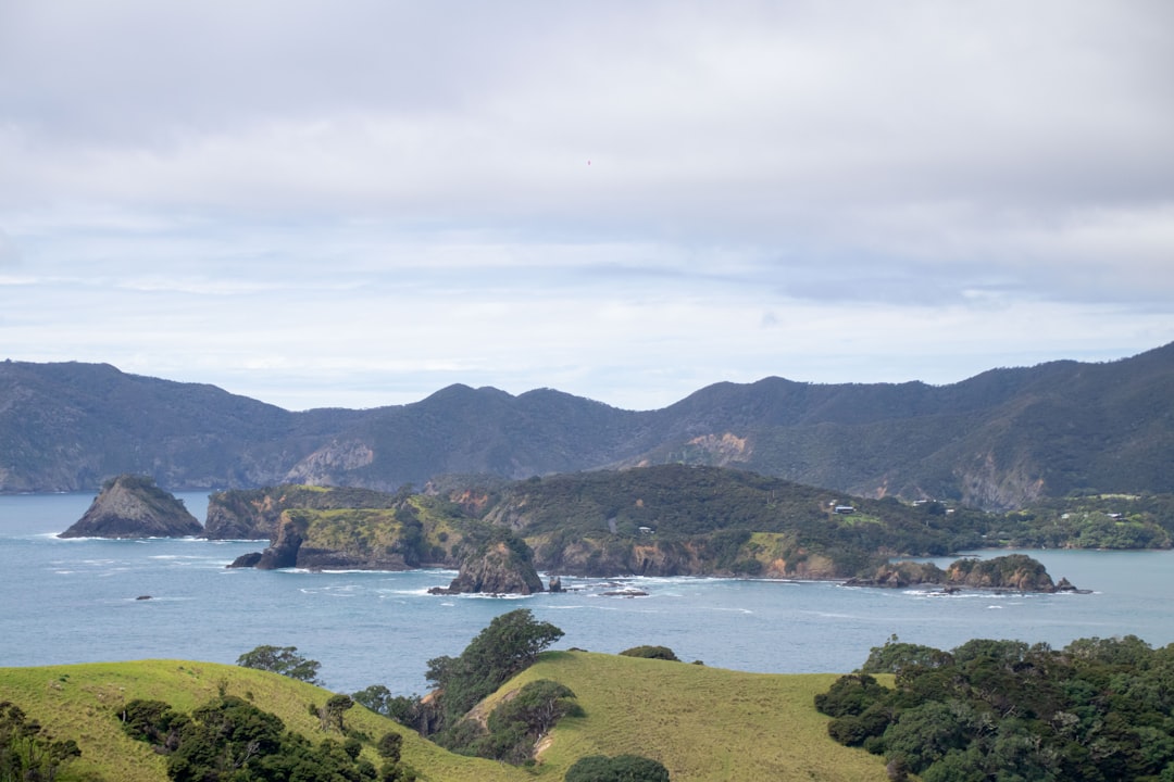 a large body of water surrounded by mountains,