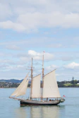 Elegant vessel handling demonstration with a schooner under sail.