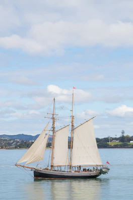 Elegant vessel handling demonstration with a schooner under sail.