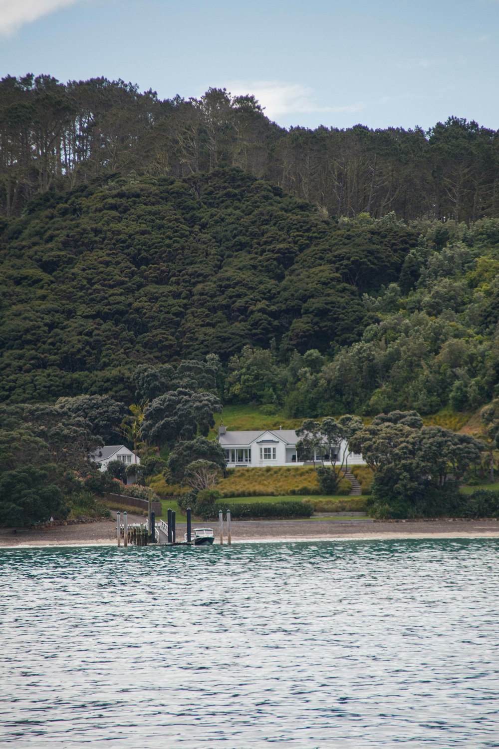 a house on the shore of a body of water