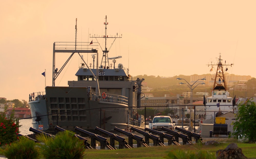 a large boat is docked in a harbor