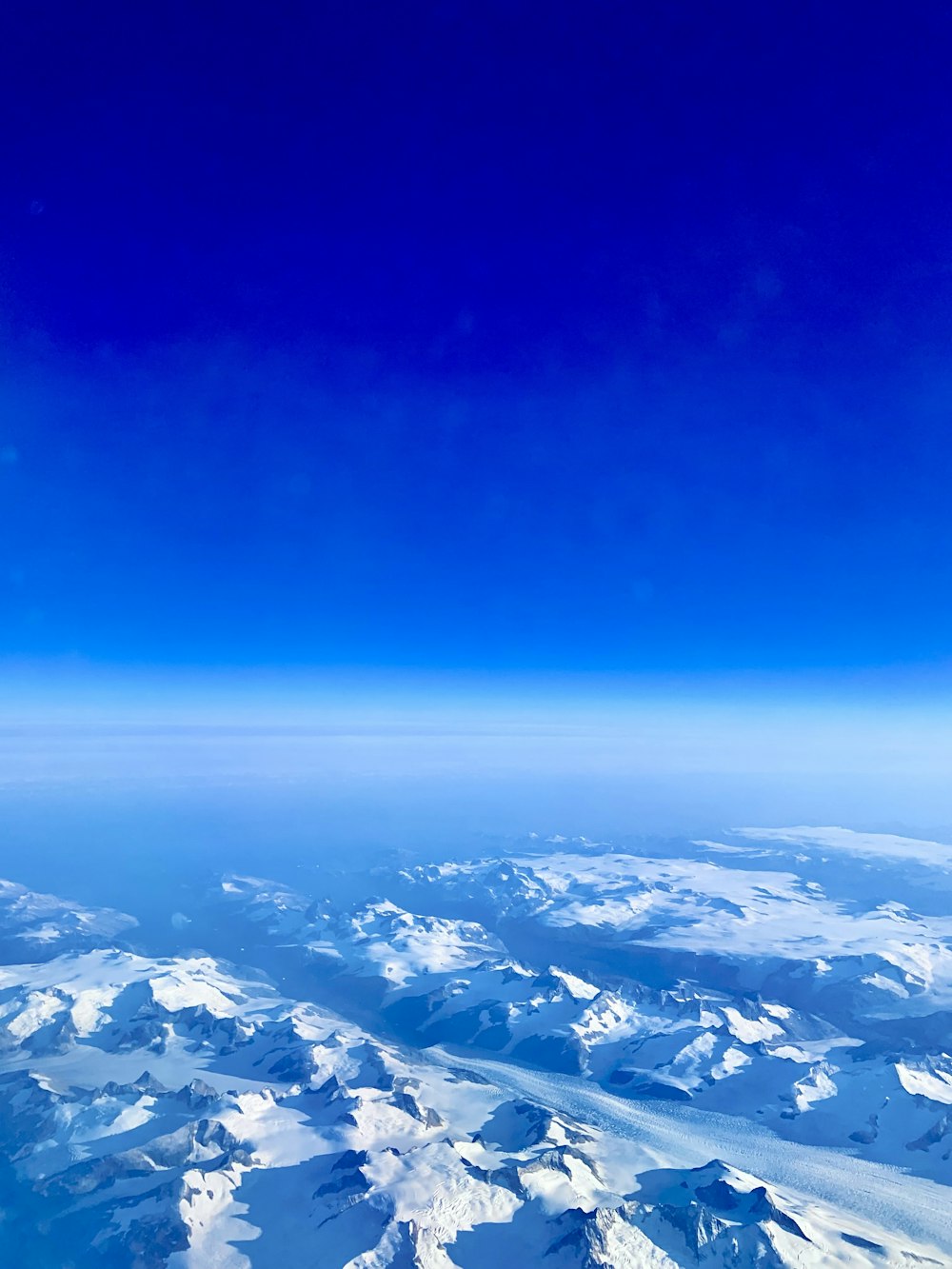 a view of a mountain range from an airplane