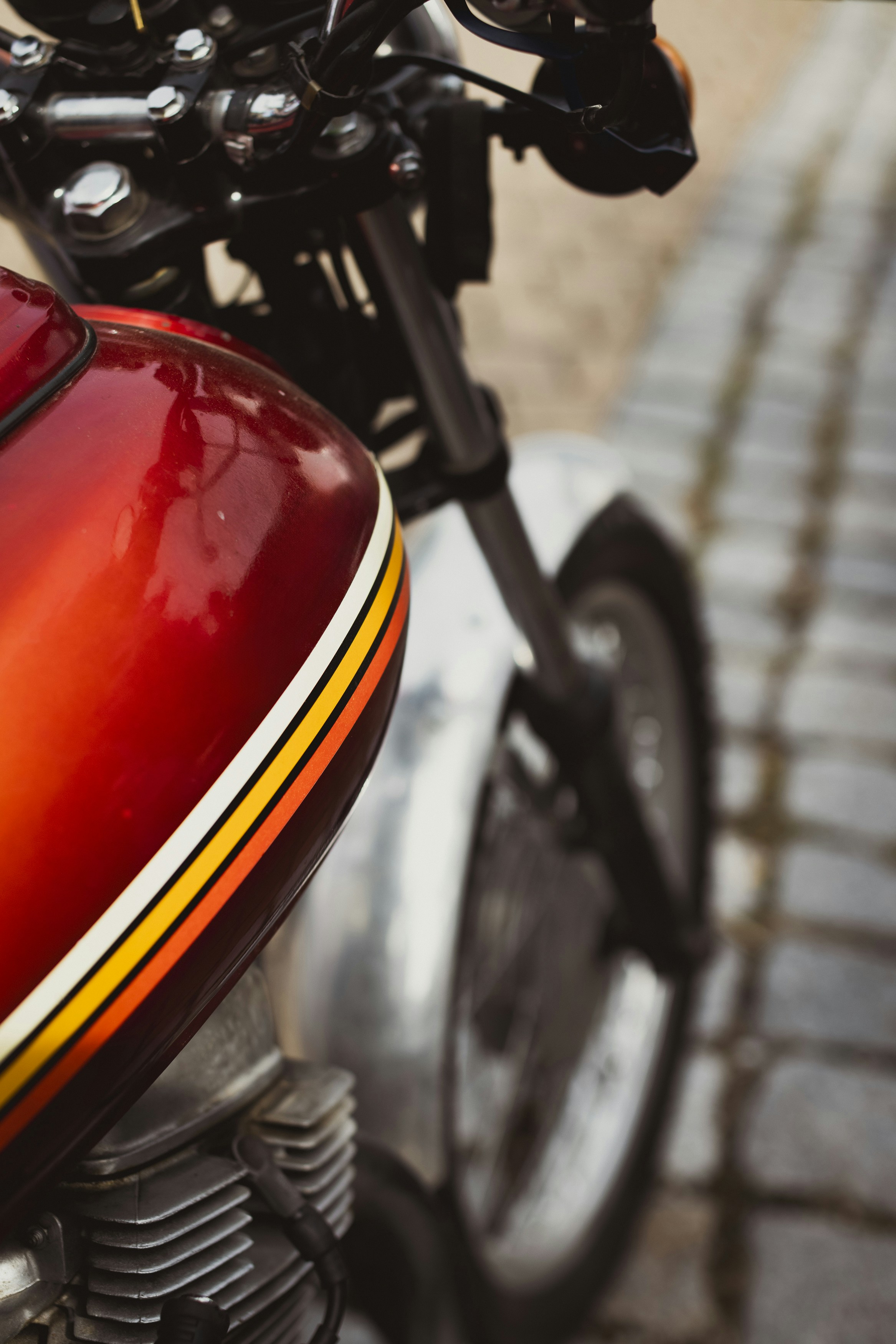 a close up of a motorcycle parked on a street