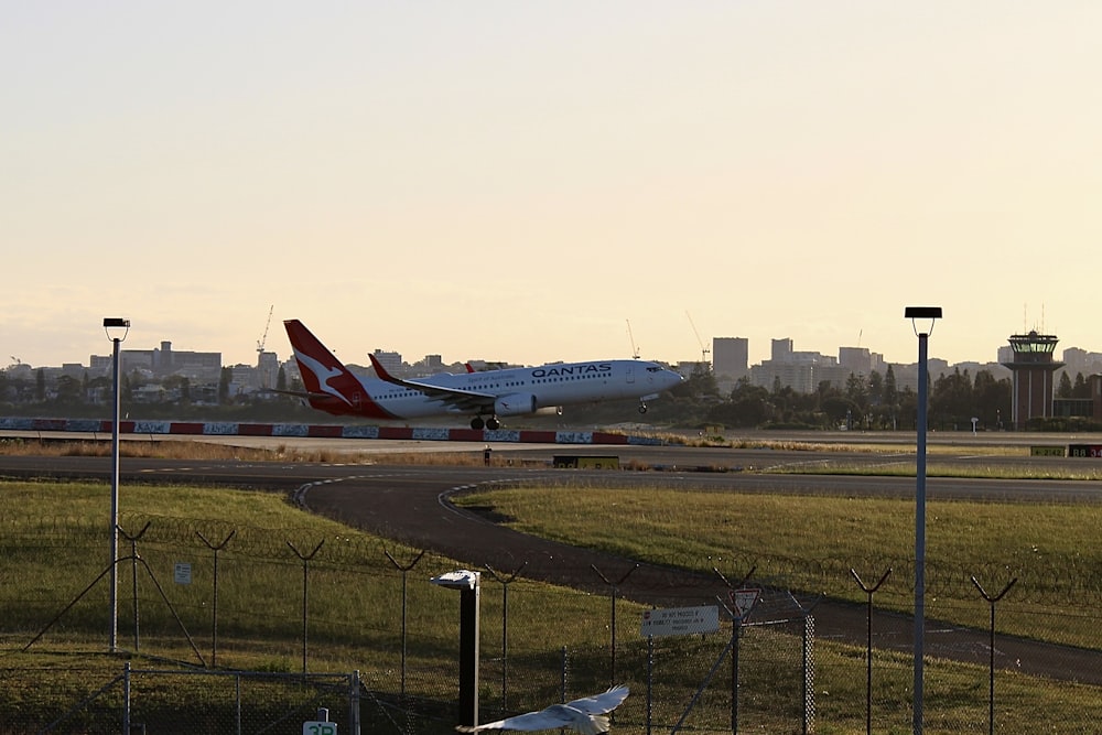 a large jetliner taking off from an airport runway