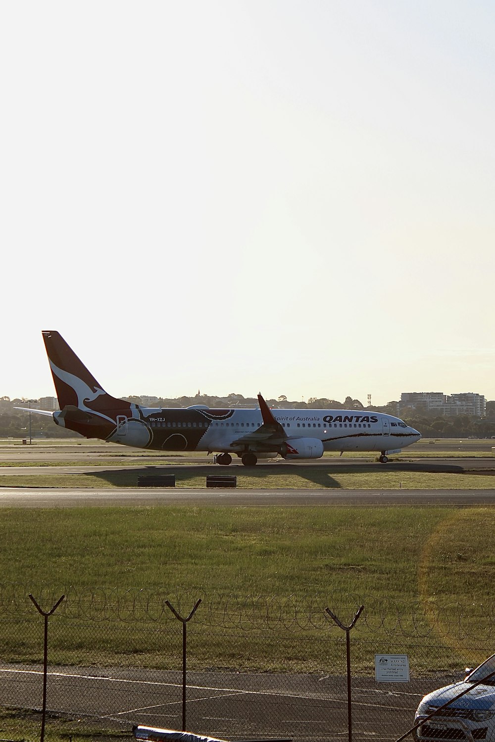 a large jetliner sitting on top of an airport runway