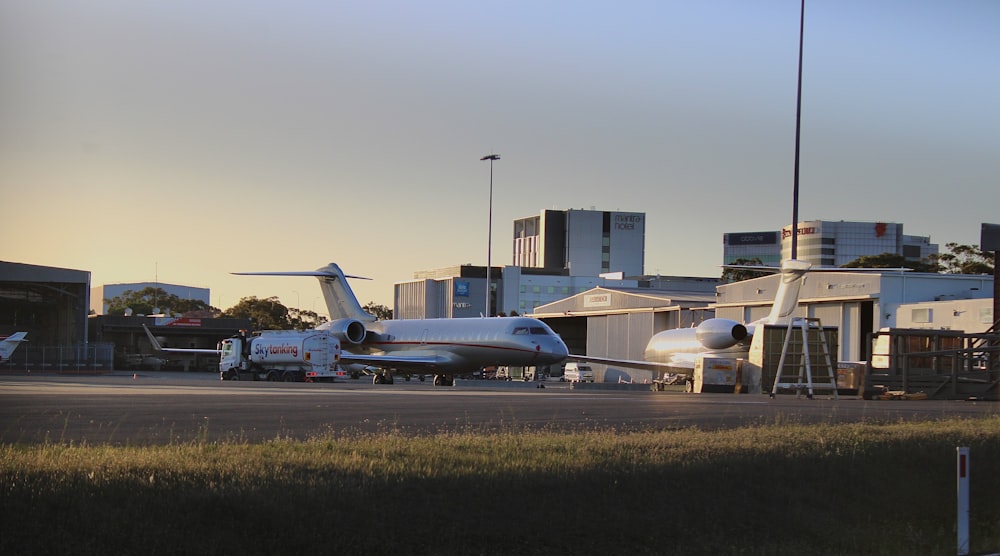 an airplane is parked on the runway at the airport