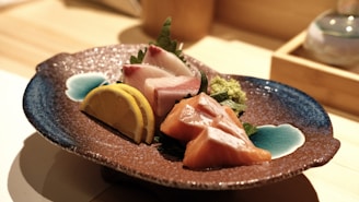 A beautifully arranged plate of sushi with vibrant colors and fresh ingredients.