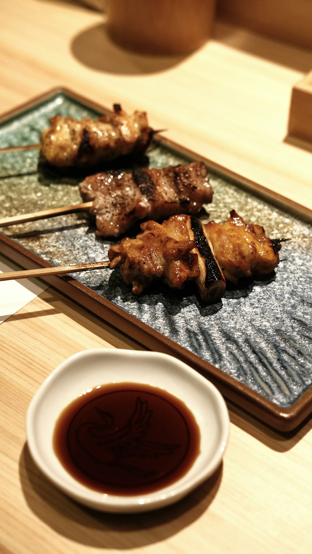 a plate of food on a table with chopsticks