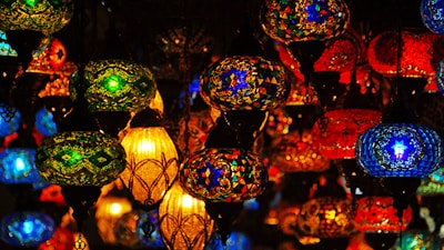 A vibrant display of various LED lanterns showcasing their unique designs.