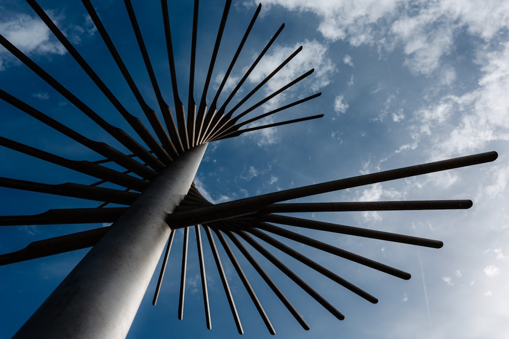 a tall metal structure with a sky in the background