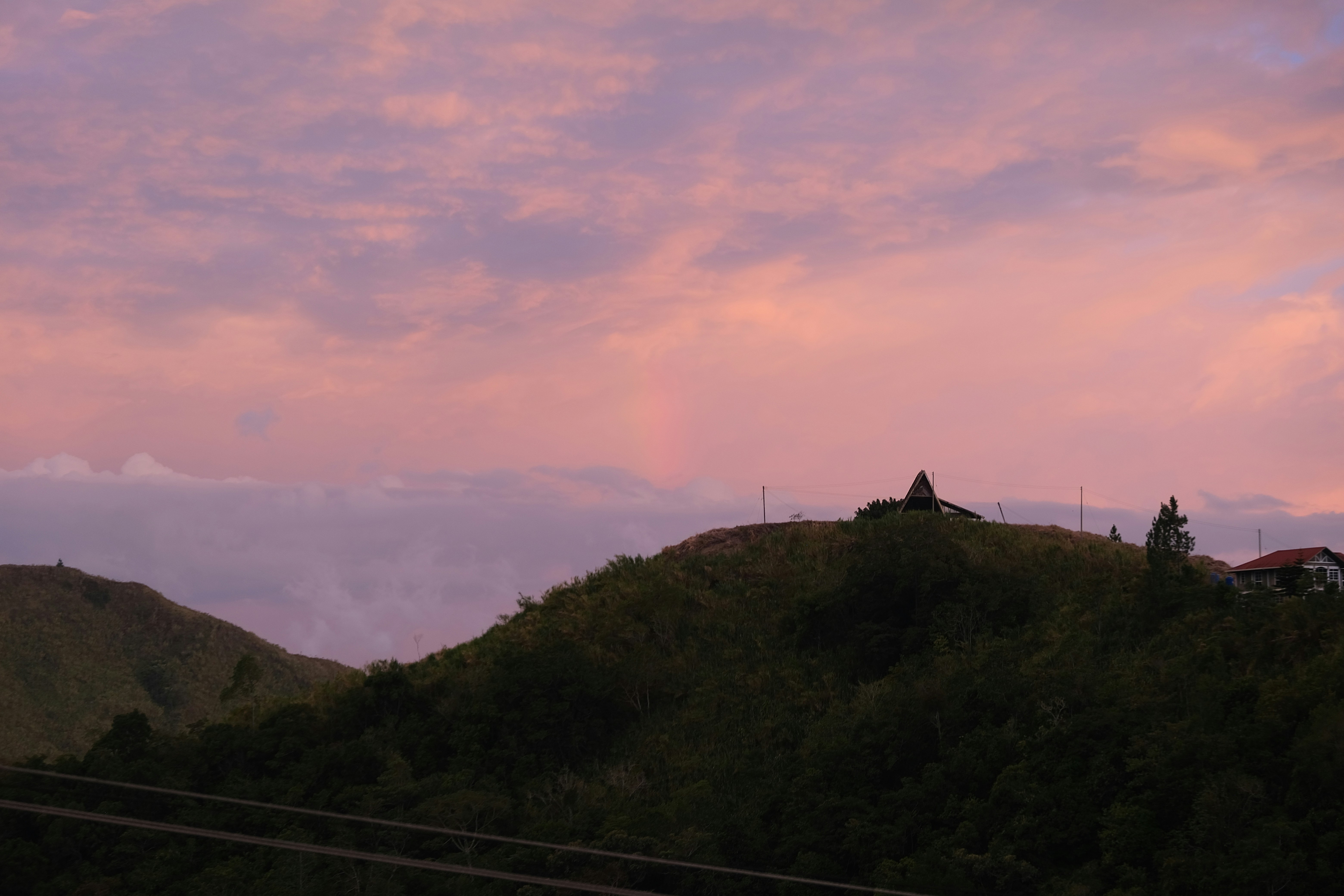 a hill with a house on top of it