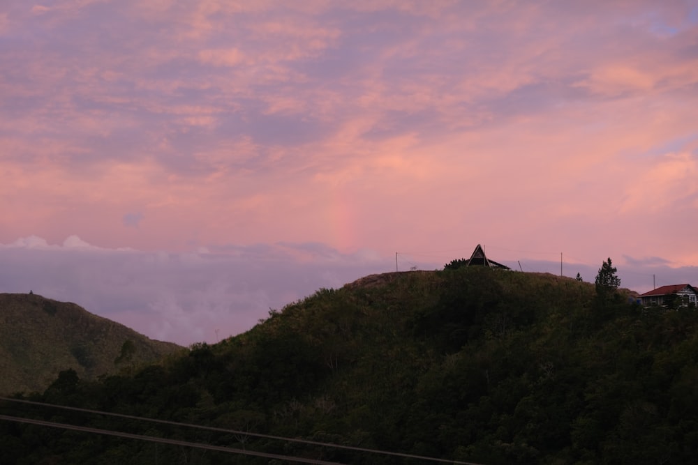 a hill with a house on top of it