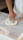 Man baking bread with flour spread on the countertop.