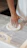 Man baking bread with flour spread on the countertop.