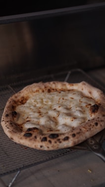 A warm, cheesy pizza fresh out of the oven with bubbling toppings.