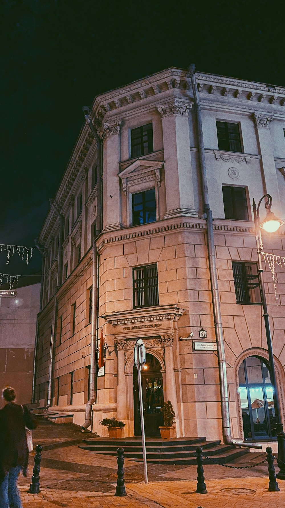 a tall building with a clock on the front of it