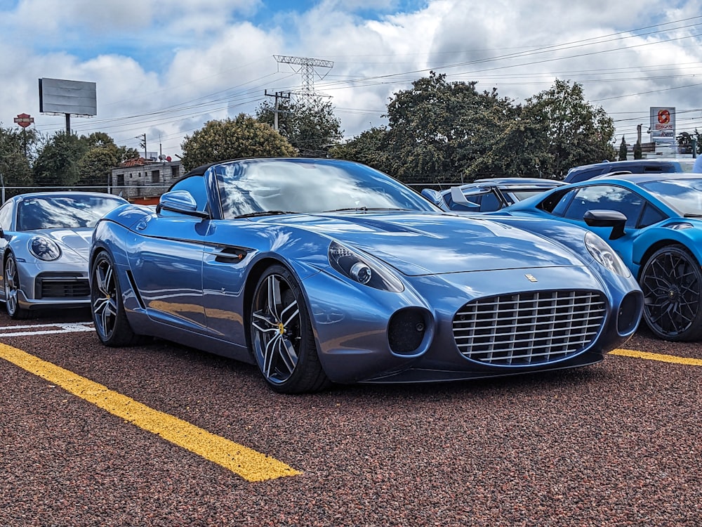 a blue sports car parked in a parking lot