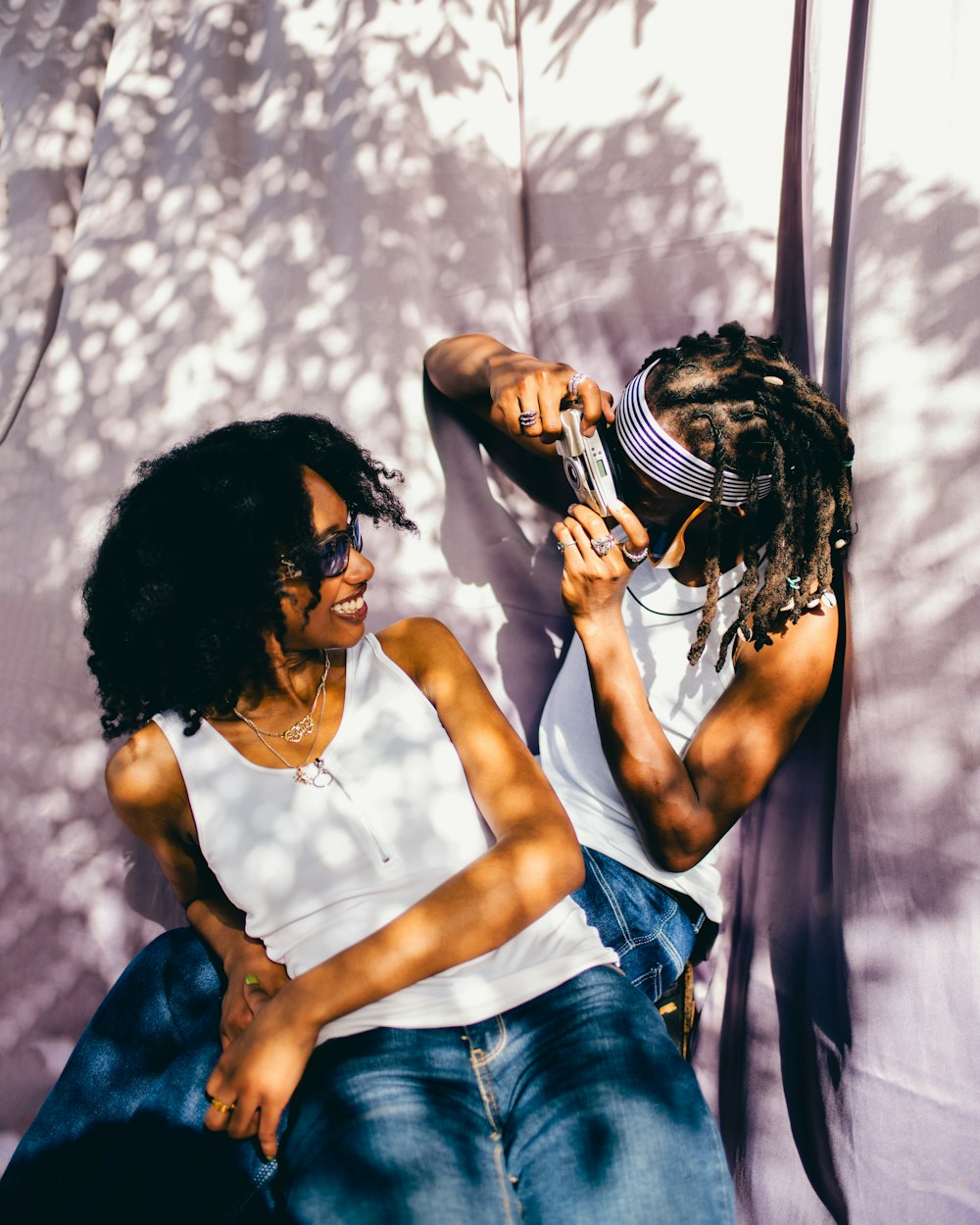 a couple of women sitting next to each other