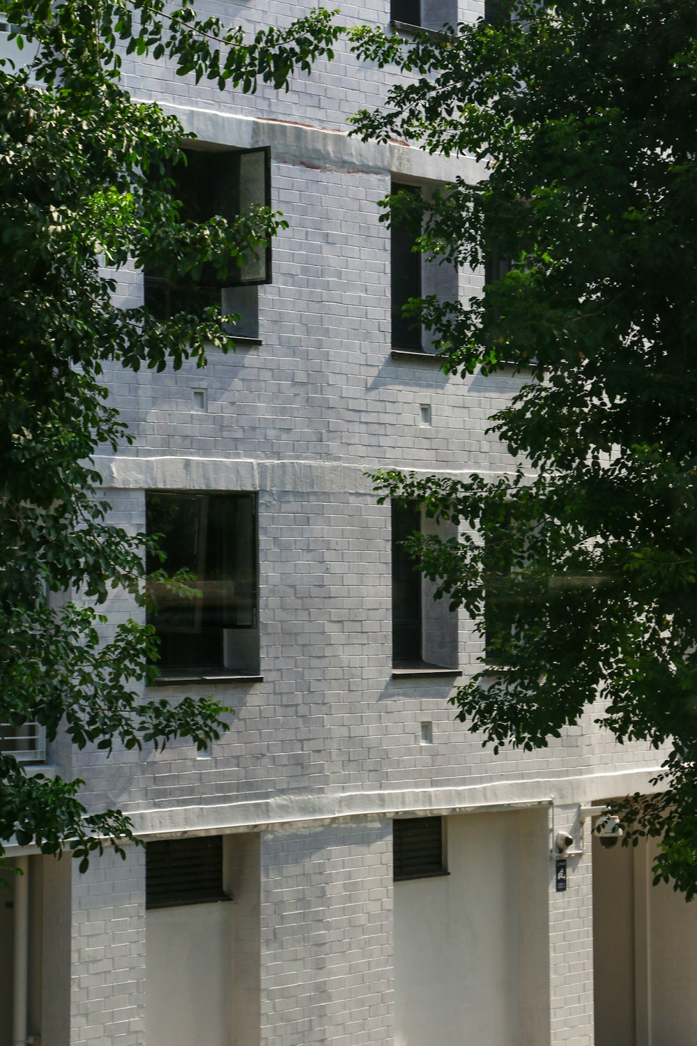 a white building with a clock on the side of it