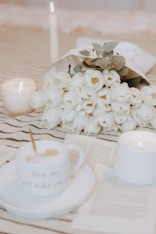 a bouquet of white flowers sitting on top of a table