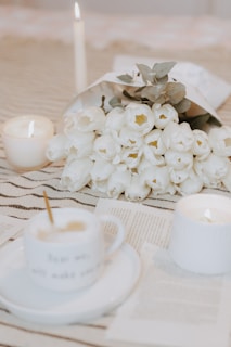 a bouquet of white flowers sitting on top of a table