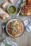 a plate of spaghetti with sauce and bread