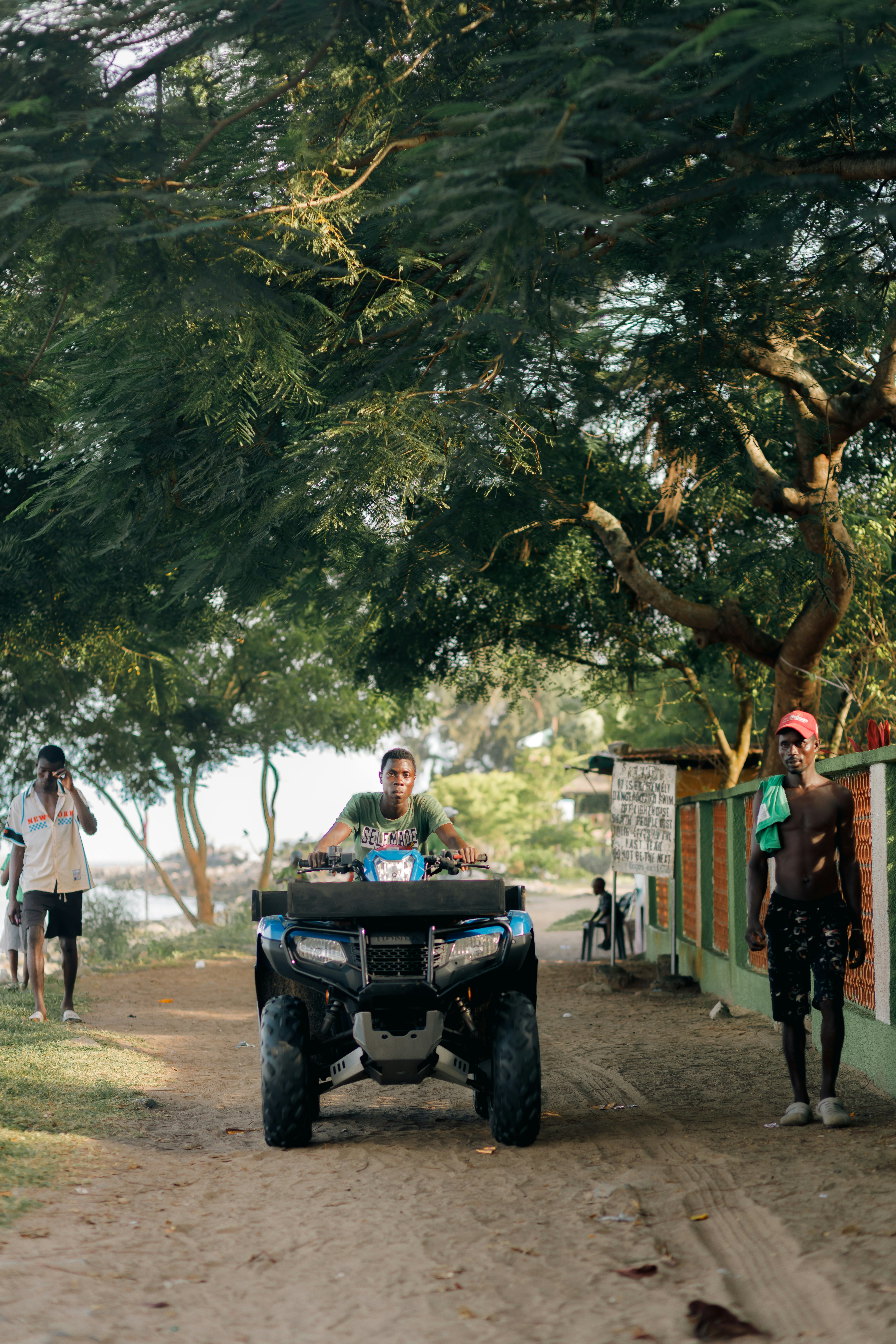 A man riding on the back of a four wheeler photo – Free Portrait Image ...
